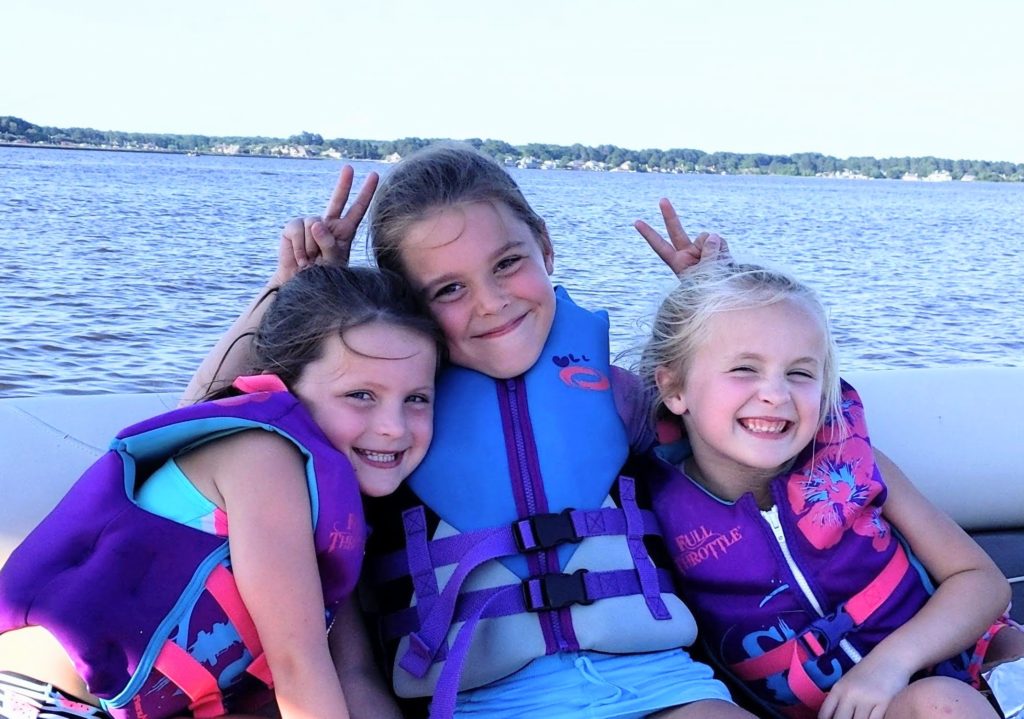Little girls in life jackets